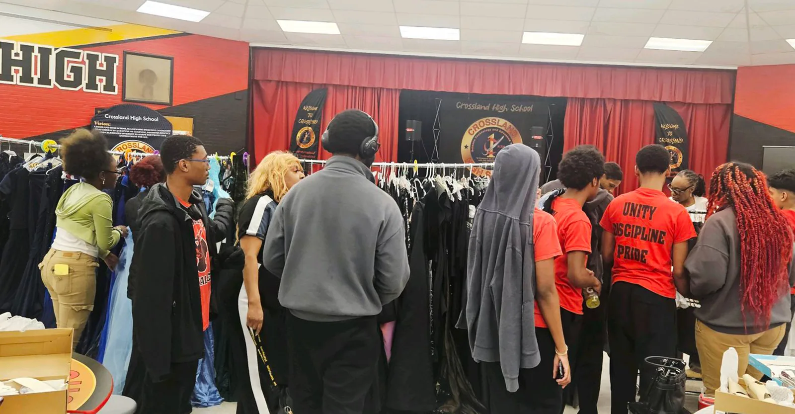Students browsing donated gowns at the Crossland High School prom shop