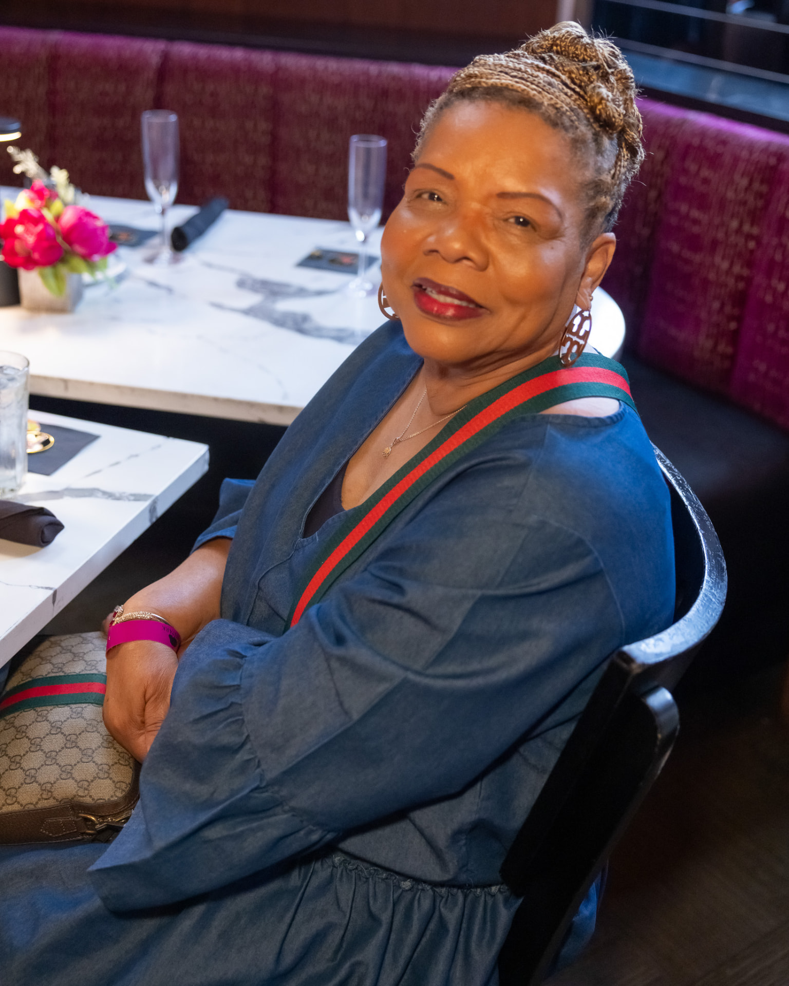 Guest seated at a brunch table with champagne flutes and floral centerpiece