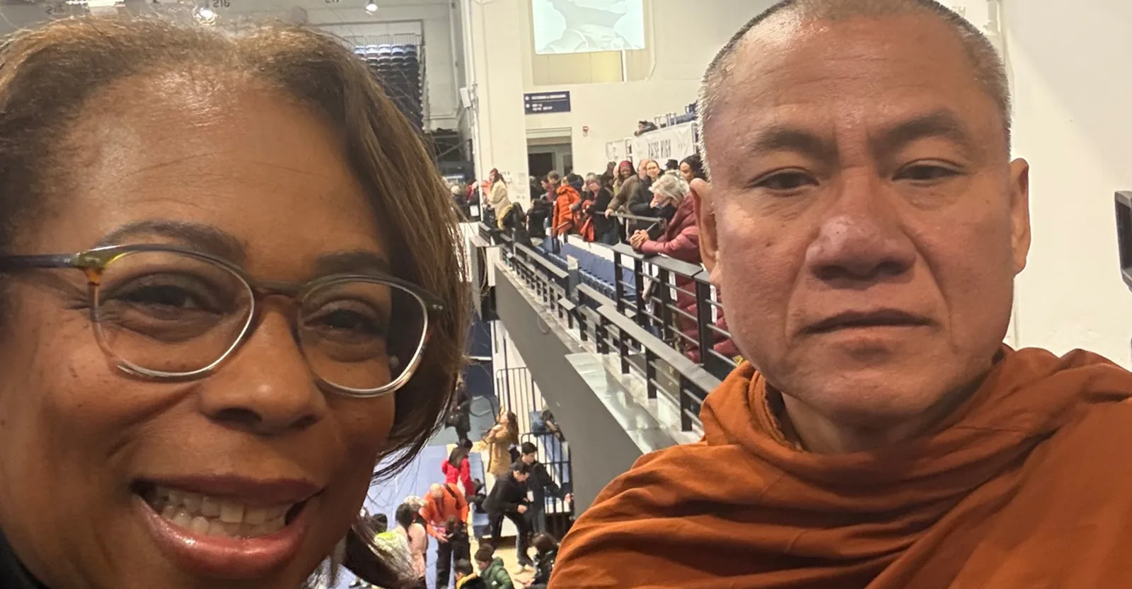 Krewe member with a community partner at a cultural exchange event